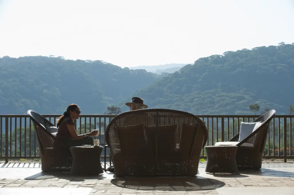 Tourist Enjoying Coffee and Views While Relaxing at Kitela Lodge