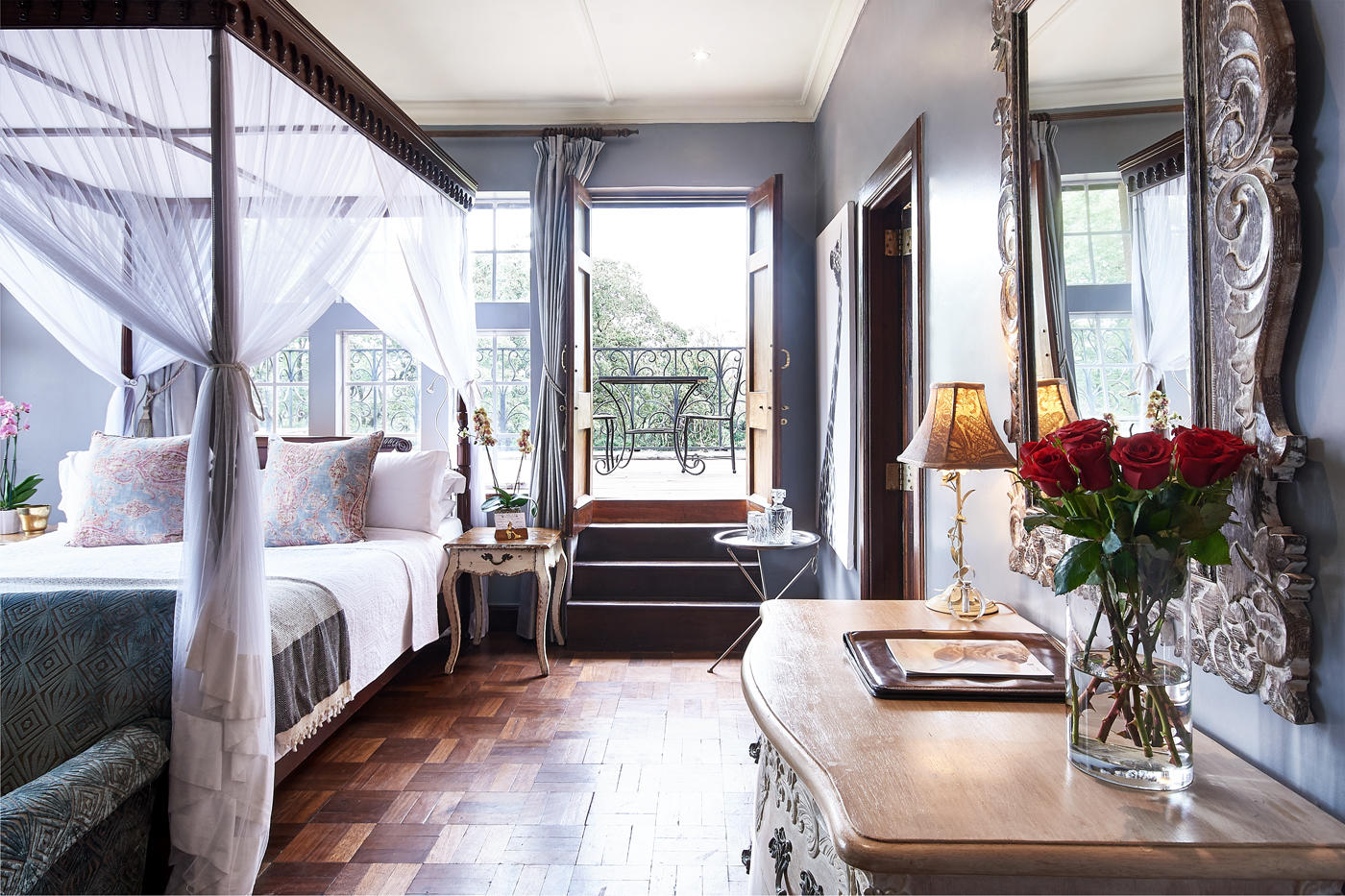 Elegant Superior Room with four-poster bed and garden outlook