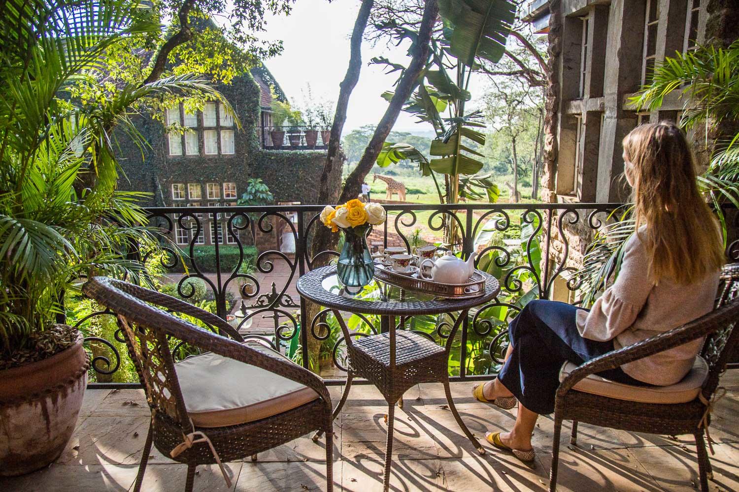 Afternoon tea on the terrace as giraffes stroll across the lawns