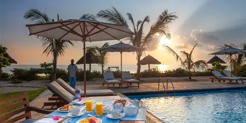 Breakfast by the pool at Kisiwa on the Beach