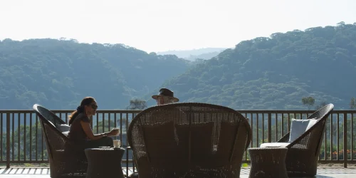 Tourist Enjoying Coffee and Views While Relaxing at Kitela Lodge