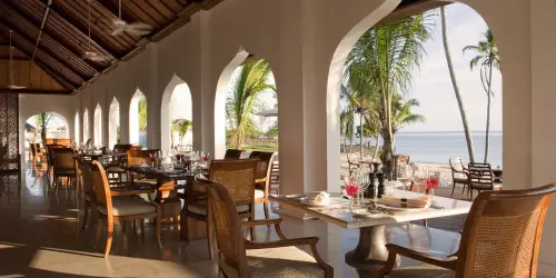 Beach view restaurant with palm trees at