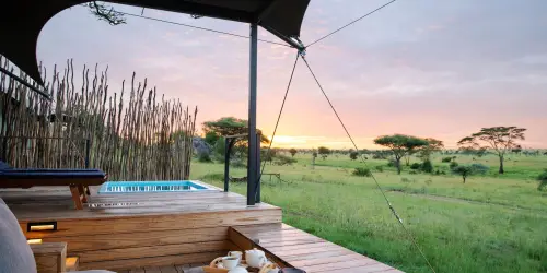 Standard suite with deck, hot tub, and sunset view at Lemala Nanyukie.